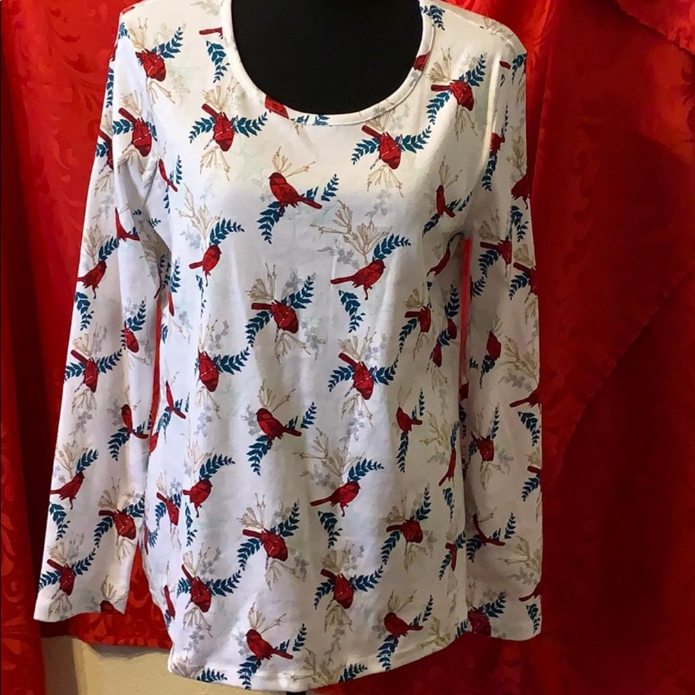 Red Cardinals adorn this long sleeved Top.